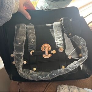 Elegant Black Satchel with Gold Details